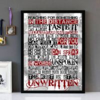 Framed wall art with black, white and red text of the song lyrics from Unwritten by Natasha Bedingfield.