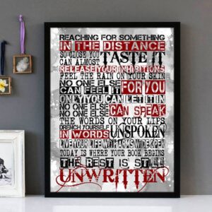 Framed wall art with black, white and red text of the song lyrics from Unwritten by Natasha Bedingfield.