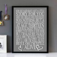 Framed wall art with white text of the song lyrics from Alive by the band Pearl Jam, with white love hearts and a grey background.